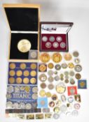 Cased coins to include Battle of Britain set, other coins, ingots and medals including Titanic,