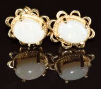 A pair of 9k gold earrings each set with a white opal, 2.3g