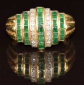 An 18ct gold ring set with emeralds and diamonds, 7.3g, size N