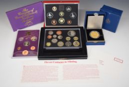 Royal Mint cased silver proof 2012 £5 coin, 2010 Royal Mint coin set, 1986 proof set and a 1980 set