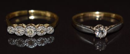 An 18ct gold ring set with five diamonds in a platinum setting (band cut, 1.9g, size L) and an