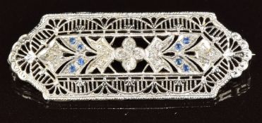 A 10k white gold pierced brooch set with diamonds and sapphires, 4.4g, 4.2 x 1.5cm