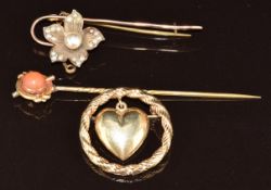 Two 9ct gold brooches, one in the form of a flower set with a faux pearl and seed pearls and the