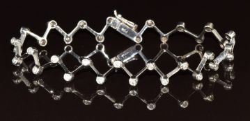 An 18k white gold bracelet in a zigzag pattern set with diamonds, 10.3g, 18cm