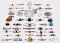 Forty seven silver brooches including butterfly wing, Celtic design, moonstone, pressed amber,