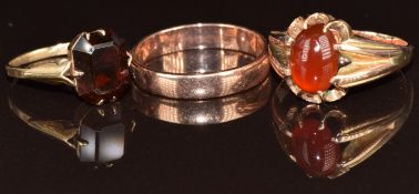 A 9ct rose gold wedding band / ring, a 9ct gold ring set with a carnelian agate cabochon, and a