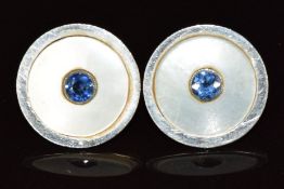 A pair of 9ct rose gold earrings set with mother of pearl and a sapphire to the centre, 2.5g