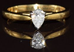 An 18ct gold ring set with a pear cut diamond of approximately 0.28ct, 2.7g, size L