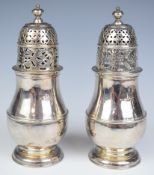 Pair of Queen Anne Britannia standard hallmarked silver sugar casters of baluster form, London 1713,