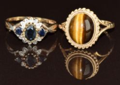 Two 9ct gold rings, one set with a tiger's eye cabochon the other sapphires and diamonds, 5.2g, size