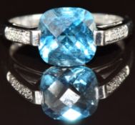A 9ct white gold ring set with a London blue topaz and diamonds, 2.8g, size P