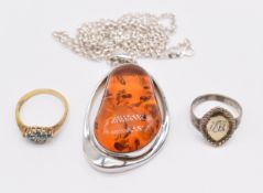 A silver ring, silver pendant and silver ring