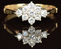 A 9ct gold ring set with diamonds in a cluster, 1.7g, size Q