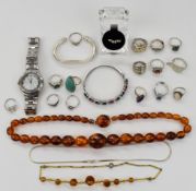 A collection of silver jewellery including bangle, twelve rings and necklace, together with