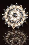 A 9ct gold ring set with sapphires and diamonds in a cluster setting (two sapphires missing), 4.