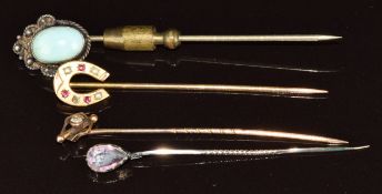 A 9ct gold stick pin (0.89g), rolled gold stick pin in the form of a horseshoe, silver stick pin and