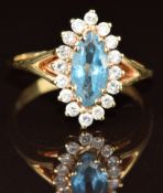 A 14k gold ring set with a marquise cut topaz surrounded by diamonds, 3.6g, size P
