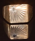 A 9ct gold signet ring set with an old cut diamond in a starburst setting, 7.5g, size J
