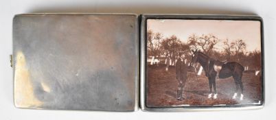 Austrian silver and enamel cigarette case decorated with a picture of a man with a horse, with