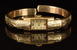 Accurist 9ct gold ladies bangle wristwatch with gold hands and Arabic numerals, silver dial and