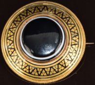Victorian brooch set with banded agate and enamel, verso a locket compartment and engraved 'H.J.D
