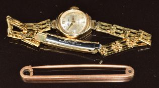 A 15ct gold bar brooch (3.6g, 5cm) and a 9ct gold watch