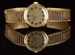 Omega 9ct gold ladies wristwatch with black hands and Arabic numerals, silver dial and signed 17