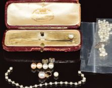 A 9ct gold stick pin set with a pearl, in original Goldsmith & Silversmith Company box, a pair of