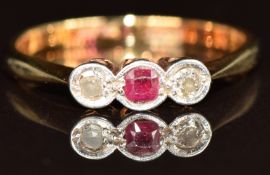 An 18ct gold ring set with a ruby and diamonds in a platinum setting, 2.1g, size J/K