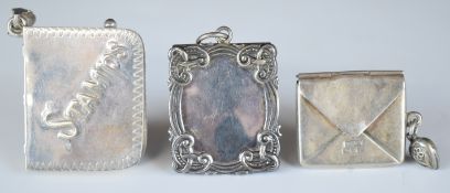 Three hallmarked and other silver stamp cases, one formed as an envelope, Chester, maker Sydney &