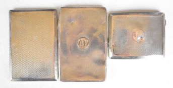 Three various hallmarked silver cigarette cases including an Art Deco example with gold initials,