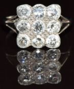 A c1915 18ct white gold ring set with nine old cut diamonds, each approximately 0.18ct, 3.5g, size
