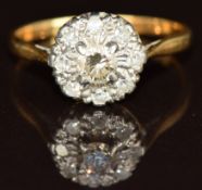 An 18ct gold ring with diamonds in a cluster, 2.2g, size N
