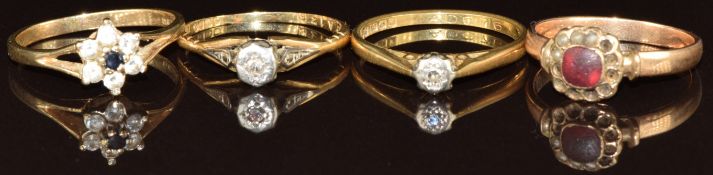Two 18ct gold rings, each set with diamond in a platinum setting (3.8g) and two 9ct gold rings one