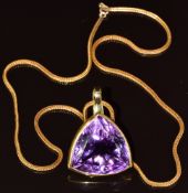 An 18ct gold pendant set with a trillion cut amethyst (25 x 19mm), on 18ct gold chain, 25.8g