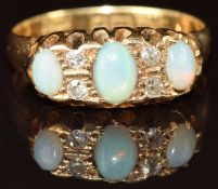 Edwardian 18ct gold ring set with three opals and old cut diamonds, Chester 1904, 3.4g, size L