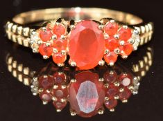 A 14k gold ring set with fire opals and diamonds, 2.6g, size R