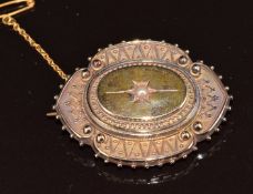 Victorian mourning brooch set with a split pearl verso a locket compartment, 9.9g, 4 x 3cm