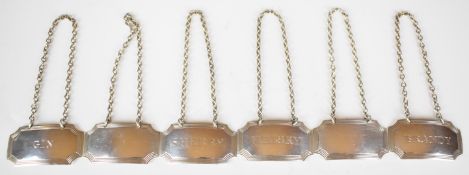 Set of six hallmarked silver Georgian style bottle tickets or labels comprising brandy, gin, sherry,