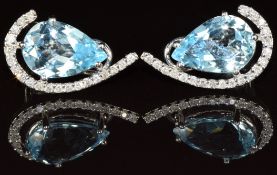 A pair of 18k white gold earrings set with a pear cut topaz surrounded by diamonds, 6.8g