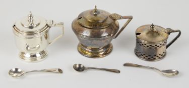 Three hallmarked silver mustards, with blue glass liners, including two Art Deco style examples,