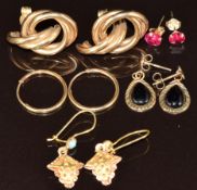 A pair of 9ct gold knot earrings, 9ct gold hoops, two pairs of 9ct gold earrings and a pair of