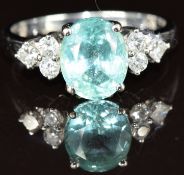 An 18k white gold ring set with an oval cut Paraiba tourmaline of approximately 1.4ct and