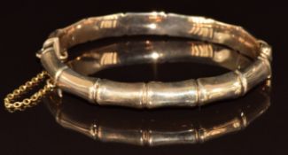 A 9ct gold bangle in the form of bamboo, 14.3g, 6.4 x 5.5cm