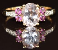 A 9k gold ring set with an oval cut morganite, tourmaline and diamonds, 2.4g, size Q