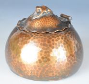 Arts & Crafts style hammered copper inkwell with frog finial, height 8cm
