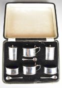 Cased Elizabeth II hallmarked silver condiment set comprising two each of pepper, salt and