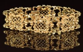 A 14ct gold bracelet made up of rectangular pierced links, 42.8g, 18.5cm