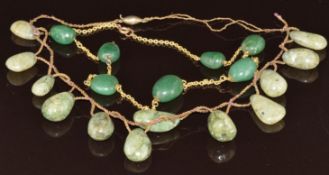 An 18ct gold necklace with aventurine quartz beads and another aventurine quartz necklace