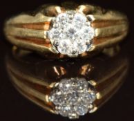 A 9ct gold ring set with diamonds in a cluster, 4.6g, size K